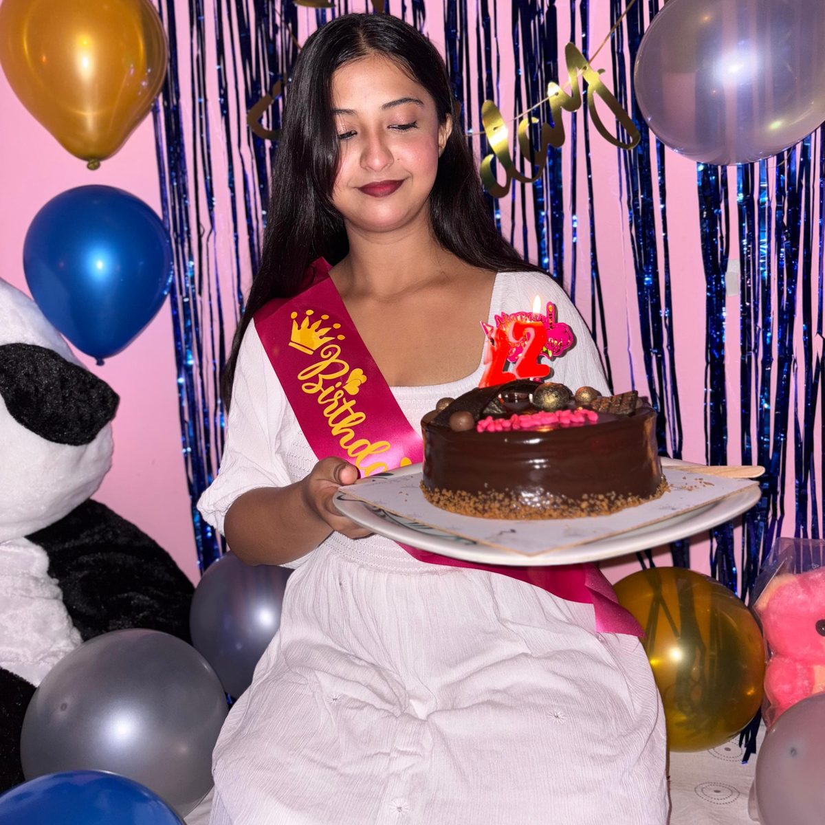 Amisha holding her birthday cake